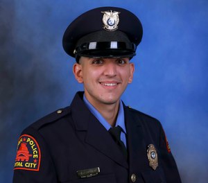 This photo provided by the Raleigh Police Department shows Officer Gabriel Torres, one of the victims of a shooting attack that stretched from the streets of a Raleigh neighborhood to a nearby walking trail last Thursday.