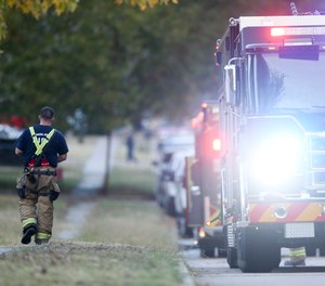 Broken Arrow, Okla., police and fire department investigate the scene of a fire with multiple fatalities.