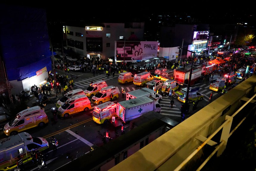 Ambulances and first responders arrived at the street near the scene of a crowd surge early Sunday in Seoul, South Korea. Officials said a large crowd pushed forward on a narrow street during Halloween festivities.
