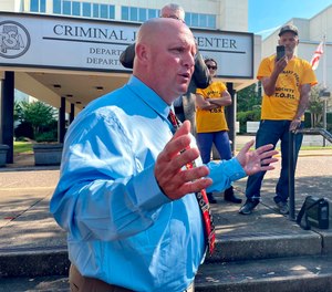 Stacy George, a former officer at Limestone Correctional Facility, speaks to reporters outside the Alabama Department of Corrections headquarters in Montgomery, Ala., Friday, Nov. 4, 2022.