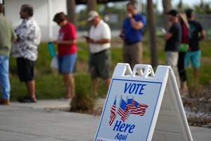 Lee County voters wait in line to cast their ballots at Wa-Ke Hatchee Recreation Center in Fort Myers, Fla. on Tuesday.