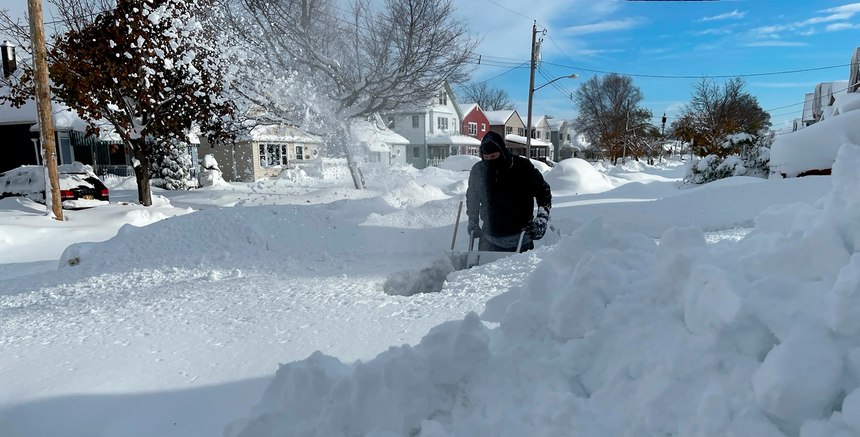 Martin Haslinger uses a snowblower outside his home in Buffalo, N.Y., on Saturday, Nov. 19, 2022 following a lake-effect snowstorm. Residents of northern New York state are digging out from a dangerous lake-effect snowstorm that had dropped nearly 6 feet of snow in some areas and caused three deaths. The Buffalo metro area was hit hard, with some areas south of the city receiving more than 5 feet by early Saturday.