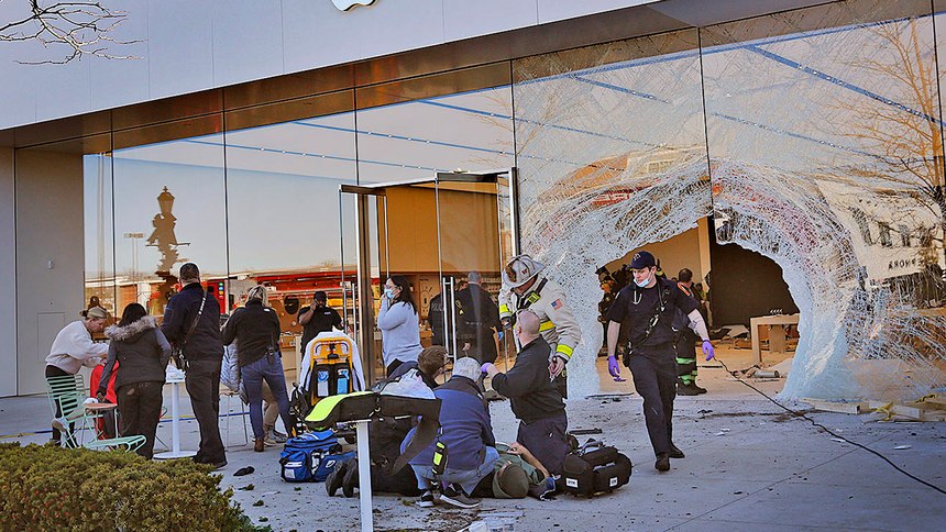 Emergency workers aid injured shoppers after an SUV drove into an Apple store in Hingham, Mass.