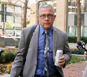 Ray J. Garcia leaves the Federal Courthouse in Oakland, Calif., Monday, Nov. 28, 2022. The federal women's prison under Garcia's supervision was known as the