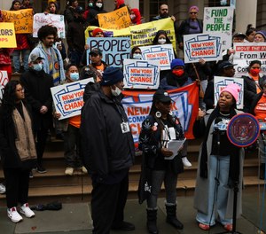 Homelessness union organizer at Vocal-NY Celina Trowell, right, speaks at a rally in New York.