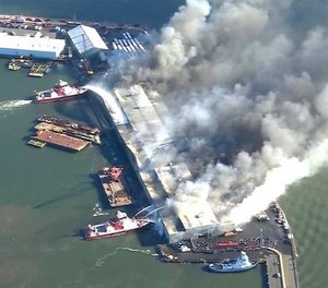 Firefighters battle a blaze at a warehouse in the Brooklyn Borough of New York.