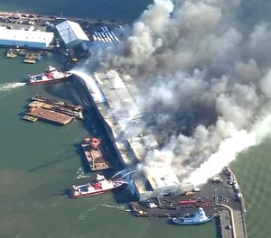 Eight people suffered minor injuries in the fire at a New York Police Department warehouse that houses DNA evidence from crime scenes as well as cars, e-bikes and motor scooters, police and fire officials said.
