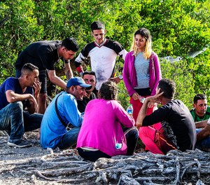 A group of Cuban migrants gather on the side of U.S. in the Middle Keys island of Duck Key, Fla., Monday Jan. 2, 2023.