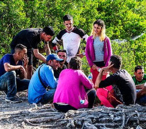 A group of Cuban migrants gather on the side of U.S. in the Middle Keys island of Duck Key, Fla., Monday Jan. 2, 2023.
