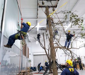 Prisoners work on climbing indoors at the Parnall Correctional Facility's Vocational Village.