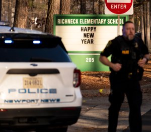 Police respond to a shooting at Richneck Elementary School, Friday, Jan. 6, 2023 in Newport News, Va. A shooting at a Virginia elementary school sent a teacher to the hospital and ended with “an individual” in custody Friday, police and school officials in the city of Newport News said.