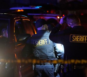 Law enforcement personnel control the scene of a shooting Monday, Jan. 23, 2023, in Half Moon Bay, Calif.