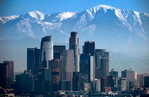 A snow-covered Mount Baldy, the highest peak among the San Gabriel Mountains, looms behind downtown Los Angeles, on Jan. 25, 2017. Actor Julian Sands, 65, was reported missing on Jan. 13. He had gone hiking.