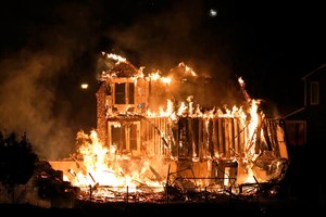 Homes burned as a wildfire ripped through a development near Rock Creek Village on Dec. 30, 2021. Just over a year after the most destructive wildfire burned in Colorado's history, a bill is being introduced in the state's legislature to create a $2-million pilot program to use cameras likely equipped with artificial intelligence technology in high-risk areas to help identify fires before they can burn out of control.