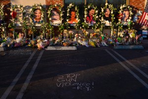 Written messages surrounded a memorial outside the Star Dance Studio in Monterey Park, Calif., Thursday