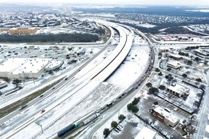An icy mix covers Highway 114 on Monday in Roanoke, Texas.