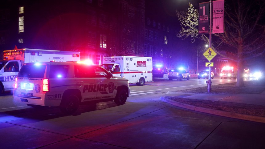 First responders stage outside Berkey Hall on the campus of Michigan State University, late Monday, Feb. 13, 2023, in East Lansing, Mich.