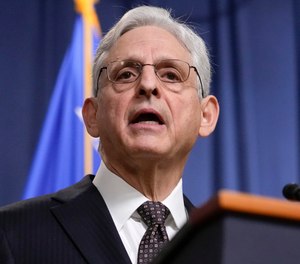 Attorney General Merrick Garland speaks during a news conference at the Department of Justice in Washington.
