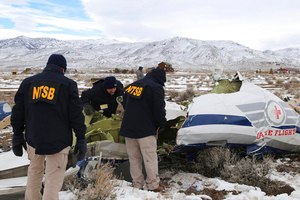 TSB investigators documented the wreckage of a Pilatus PC-12 airplane, a medical air transport flight operated by Guardian Flight, on Feb. 26 in Dayton, Nevada. Parts of the right wing of the medical airplane that crashed last month, killing all five people on board, fell apart mid-flight, according to a new federal report. The National Transportation Safety Board's three-page report released Wednesday says wing parts were located as far as 0.70 miles southwest of the wreckage site in Stagecoach, Nevada.