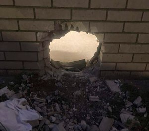 A hole in the wall of a prison cell in Newport News, Va.