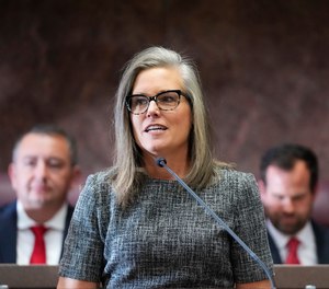 Democratic Arizona Gov. Katie Hobbs, center, delivers her state of the state address at the Arizona Capitol.