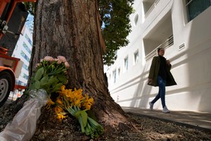 Flowers have been set outside an apartment building where technology executive Bob Lee was fatally stabbed Wednesday in San Francisco.