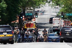 Law enforcement officers worked near the scene of the shooting Wednesday in Atlanta.