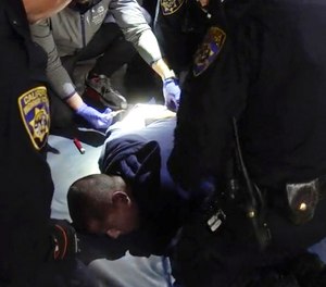 In this image taken from a nearly 18-minute video taken by a California Highway Patrol sergeant, Edward Bronstein, 38, is taken into custody by CHP officers on March 31, 2020, following a traffic stop in Los Angeles.