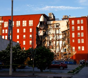 Emergency crews work the scene of a partial apartment building collapse Sunday, May 28, 2023, in Davenport, Iowa.