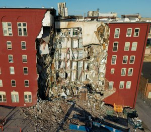 An apartment building that partially collapsed two days earlier can be seen Tuesday, May 30, 2023, in Davenport, Iowa. Five residents of the six-story apartment building remained unaccounted for and authorities fear at least two of them might be stuck inside rubble that was too dangerous to search.