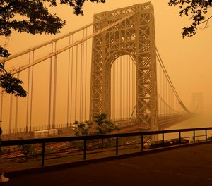 Intense Canadian wildfires are blanketing the northeastern U.S. in haze, prompting warnings for vulnerable populations to stay inside.