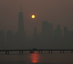 The sun rises over the lower Manhattan skyline as seen from Jersey City, N.J., Thursday, June 8, 2023.
