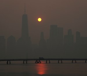 The sun rises over the lower Manhattan skyline as seen from Jersey City, N.J., Thursday, June 8, 2023.