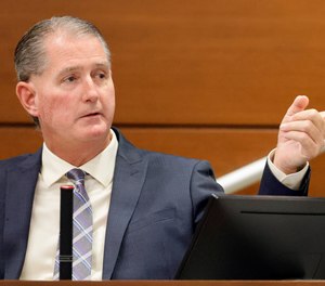 Coral Springs Police Sgt. Jeffrey Heinrich points to the defendant as he testifies during the trial of former Marjory Stoneman Douglas High School School Resource Officer Scot Peterson.