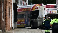 Baltimore bus crashes into cars, building, injuring 16 people