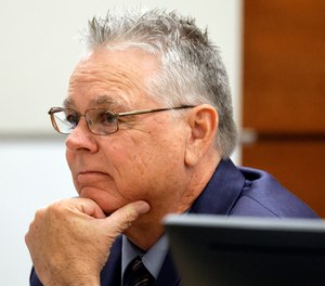 Former Marjory Stoneman Douglas High School School Resource Officer Scot Peterson sits at the defense table during his trial.