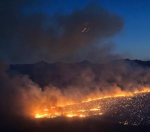 Smoke rises from a brush fire in the Scottsdale area.