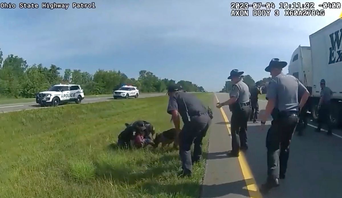 Ohio officer put on paid leave amid probe into releasing K9 on surrendering truck driver