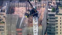 Video: NYC construction crane collapses during fire