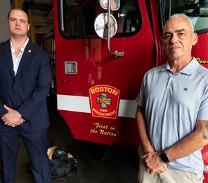 Boston firefighter Daniel Ranahan, left, and retired Brockton deputy fire chief Joe Marchetti pose at the Engine 28 fire station, Friday, July 14, 2023, in the Jamaica Plain neighborhood of Boston. Both Ranahan and Marchetti are cancer survivors.