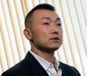 Baimadajie Angwang is interviewed at the Law Office of John F. Carman, Esq., Wednesday, Feb. 1, 2023, in Garden City, N.Y. Angwang, a suspended New York City police officer who had been accused -- then later cleared -- of spying for China is fighting to be reinstated, but the department wants him fired for refusing to be interrogated by the bureau of internal affairs exploring possible disciplinary action.