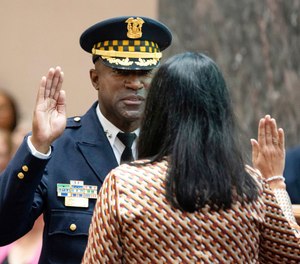 New Superintendent of the Chicago Police Department Larry Snelling is sworn in by City Clerk Anna Valencia during a special City Council meeting at City Hall in the Loop.