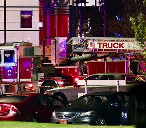 A Baltimore City Fire Department truck stages at Morgan State University during a shooting on the campus Tuesday, Oct. 3, 2023, in Baltimore.