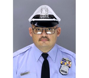 In this undated photo released by the Philadelphia Police Department Office of Public Affairs shows police officer Richard Mendez.