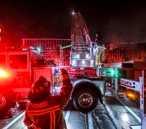 Firefighters work at the scene of a fast-moving fire, Feb. 10, 2021, in Atlanta. The city's fire chief announced on Monday, Oct, 23, 2023, that Atlanta Fire Rescue has temporarily closed three of its more than 30 fire stations because of truck breakdowns and a shortage of firefighters.