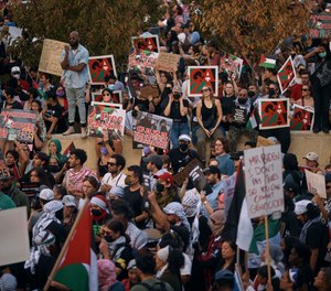 Protesters gather during a pro-Palestinian demonstration demanding a cease fire, Saturday, Oct. 28, 2023, in New York.