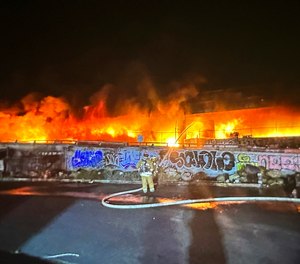 This photo provided by the California Department of Transportation shows an early morning fire along Interstate 10 near downtown Los Angeles, Saturday, Nov. 11, 2023.