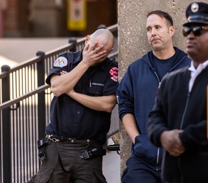 Chicago Fire Department personnel mourn outside Advocate Illinois Masonic Medical Center after a firefighter passed after battling an early morning blaze in Chicago, Monday, Nov. 13, 2023. Firefighter Andrew
