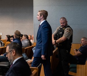 Austin police officer Christopher Taylor, right, sits alongside his attorney Doug O'Connell during his murder trial at the Blackwell-Thurman Criminal Justice Center, Wednesday, Nov. 15, 2023, Austin, Texas.