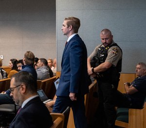 Austin police officer Christopher Taylor, right, sits alongside his attorney Doug O'Connell during his murder trial at the Blackwell-Thurman Criminal Justice Center, Wednesday, Nov. 15, 2023, Austin, Texas.
